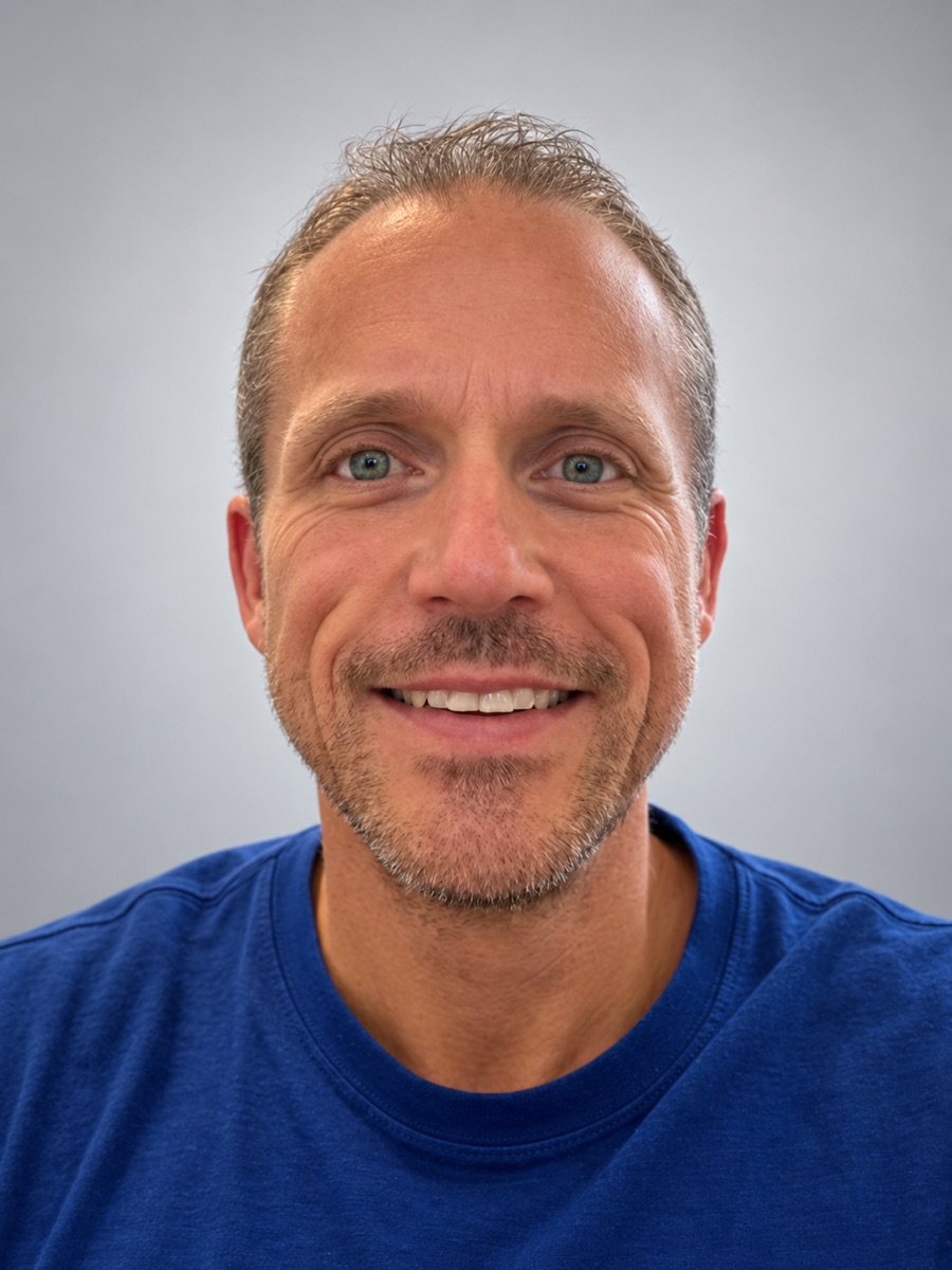 Ole Gjerde, smiling, in a blue t-shirt